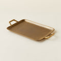 Brass metal tray with handles.