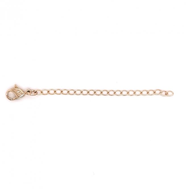 A rose gold-colored Swarovski chain extender lying on a plain background.