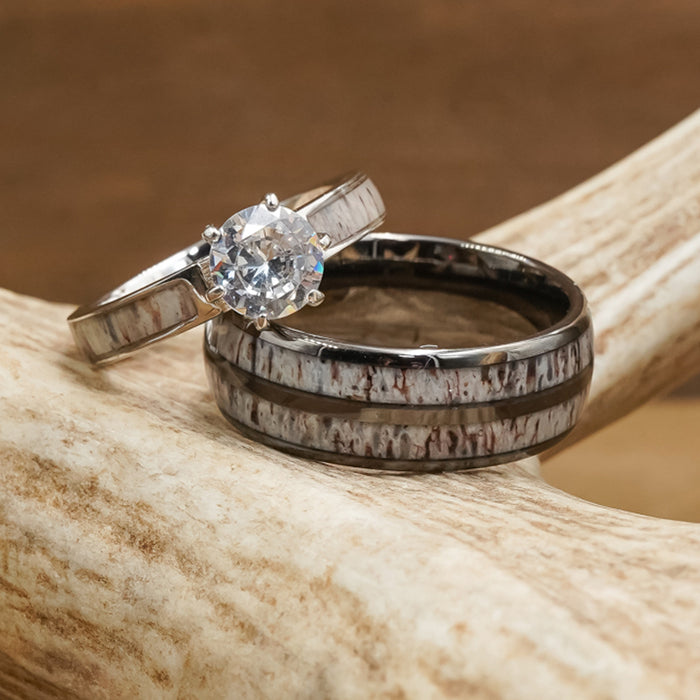 The Bryce Canyon, a silver engagement ring featuring a round diamond paired with a matching wedding band adorned with a rustic pattern, rests on a textured antler and captures the natural beauty of Bryce Canyon.