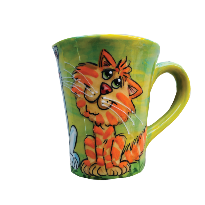 image of whimsical tabby cat painted by artist Debby Carman on green ceramic coffee mug